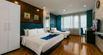 SUITE TRIPLE ROOM WITH BALCONY CITY VIEW